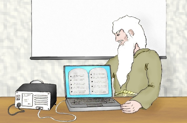 Moses fiddling with a laptop